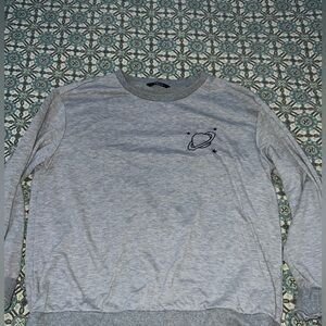 grey crewneck with planets